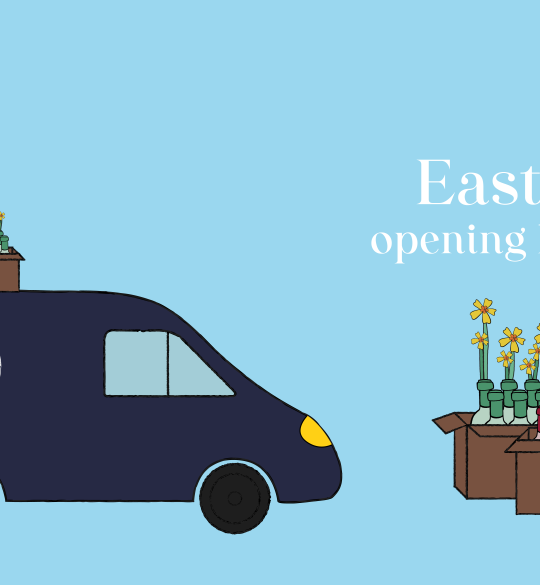 Easter Opening Hours: Ellis van and wine bottles crates with daffodils