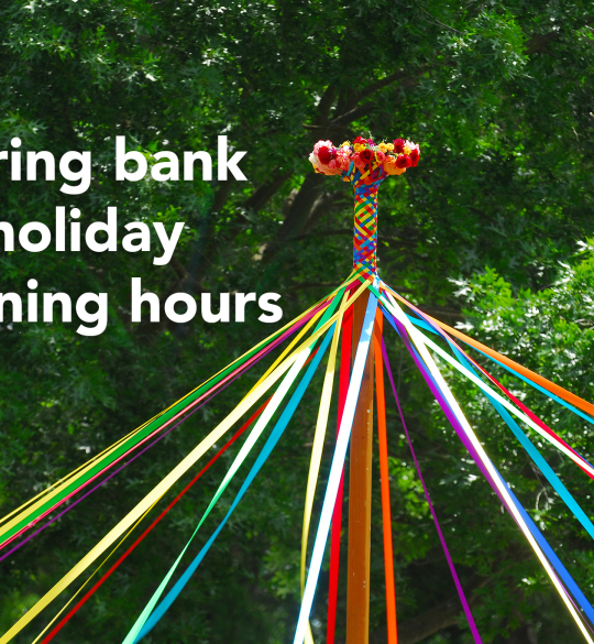 Colourful May pole - "spring bank holiday opening hours"