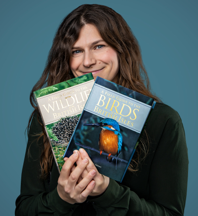 Angelica holding bird and wildlife books