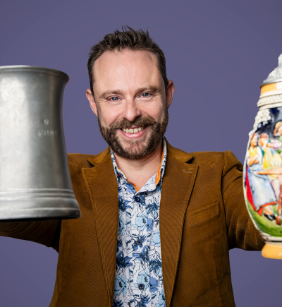 Jonny holding vintage beer tankards